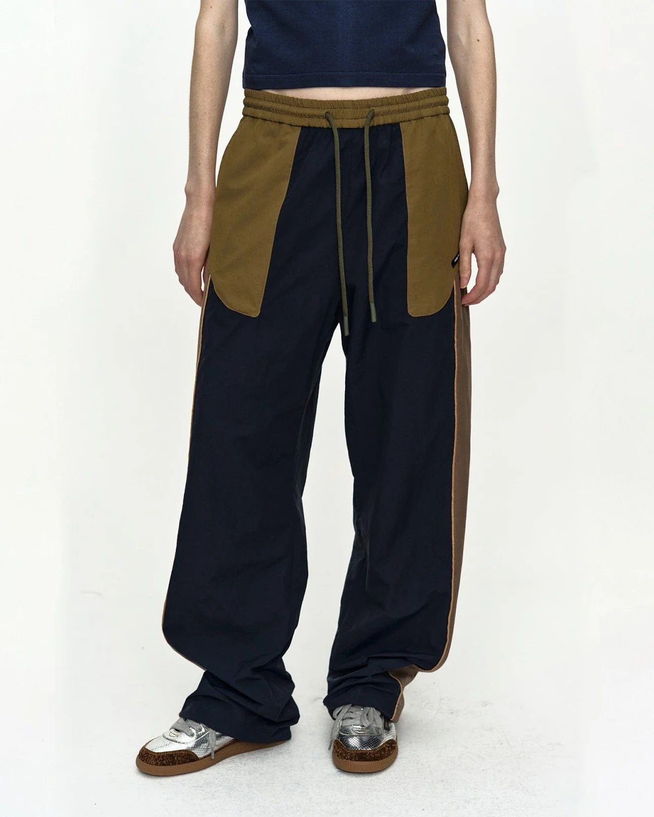 UNISEX COLOR BLOCK NYLON TRACK PANTS IN NAVY/KHAKI